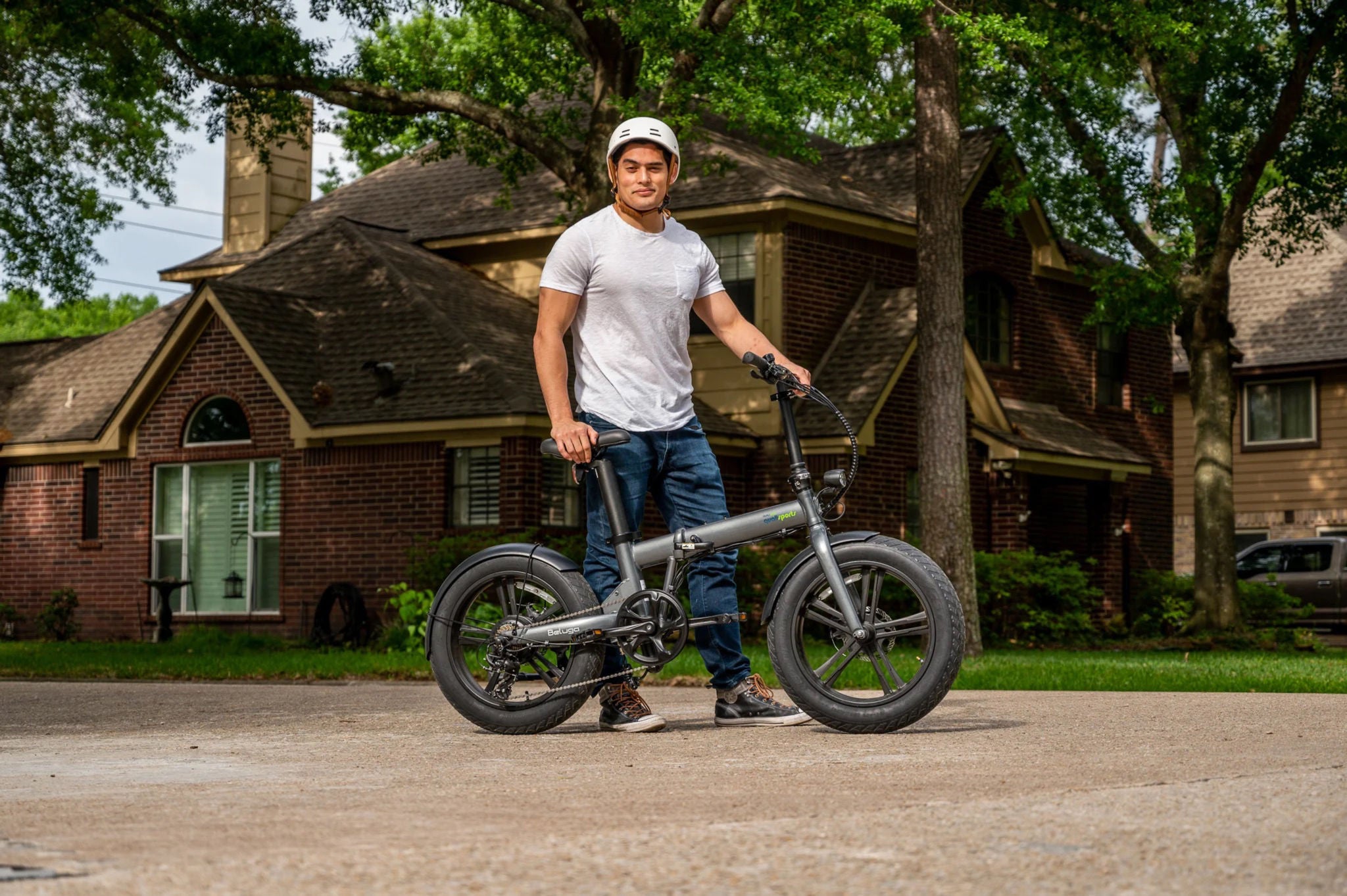 Model with helmet pushing a Beluga Ebike