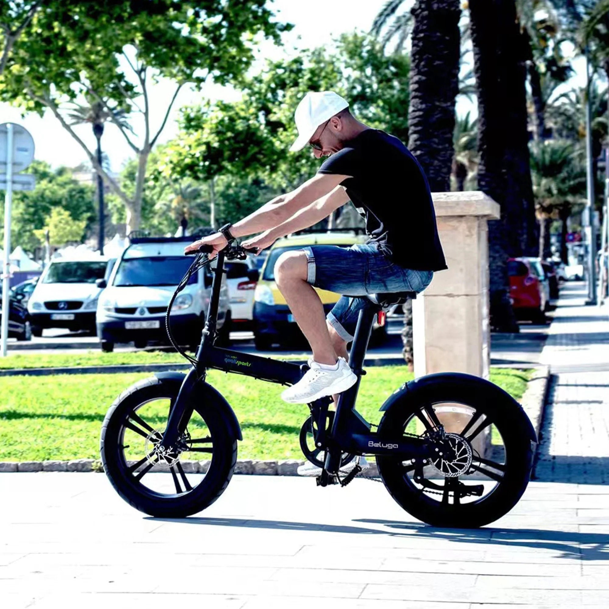 The man riding the beluga folding e-bike.