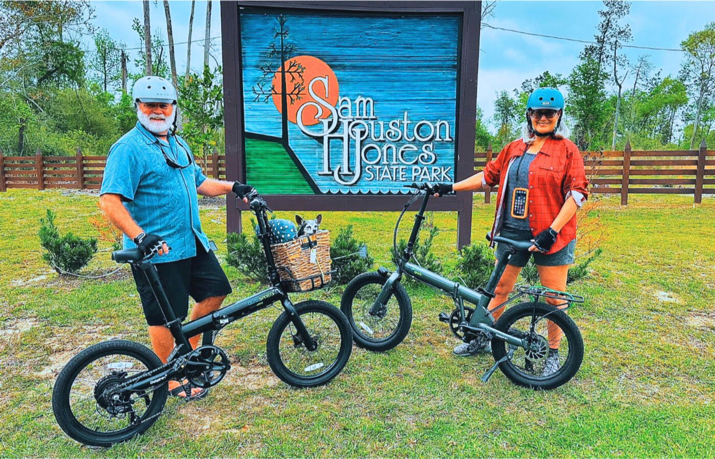 Elderly couple traveling with pets on dolphin folding e-bikes