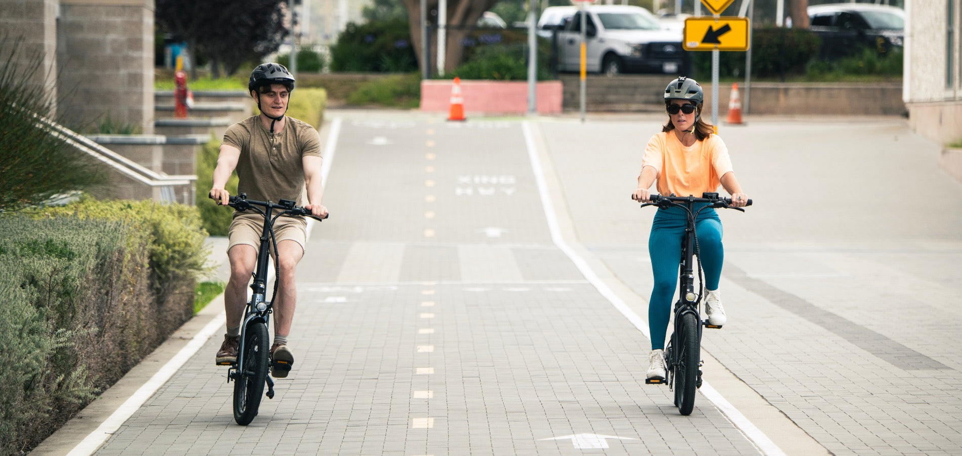 Couple riding Dolphin Folding Ebike