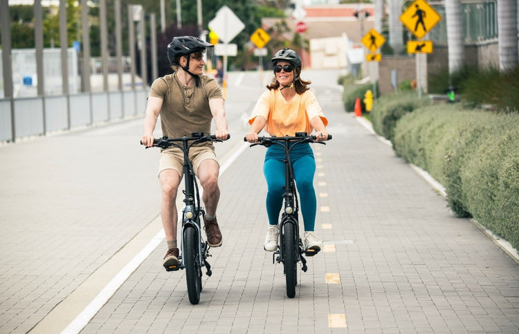 son and mother riding the qualisports folding electric bike